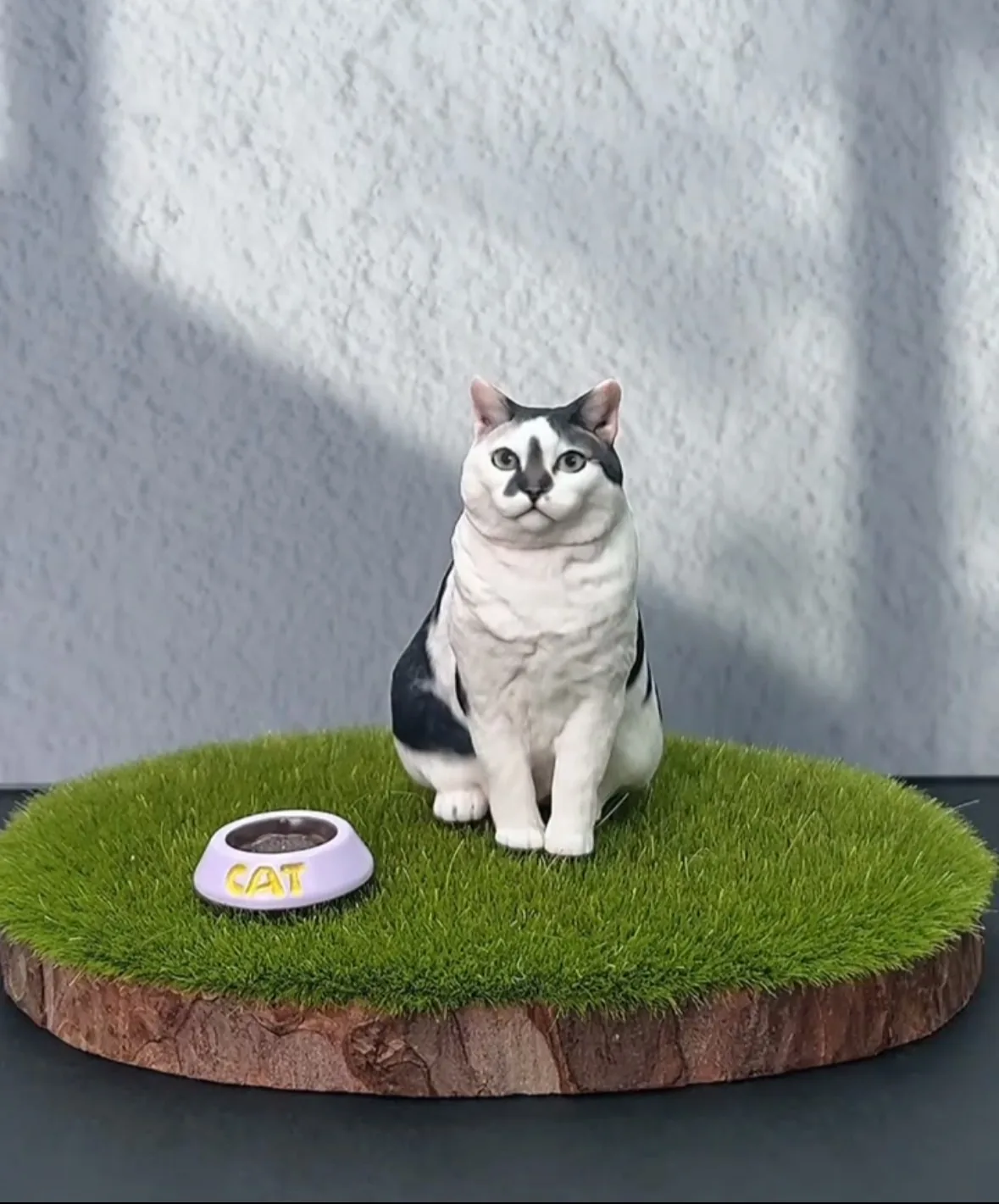 Teddy inspecting a Tiny Presence figurine