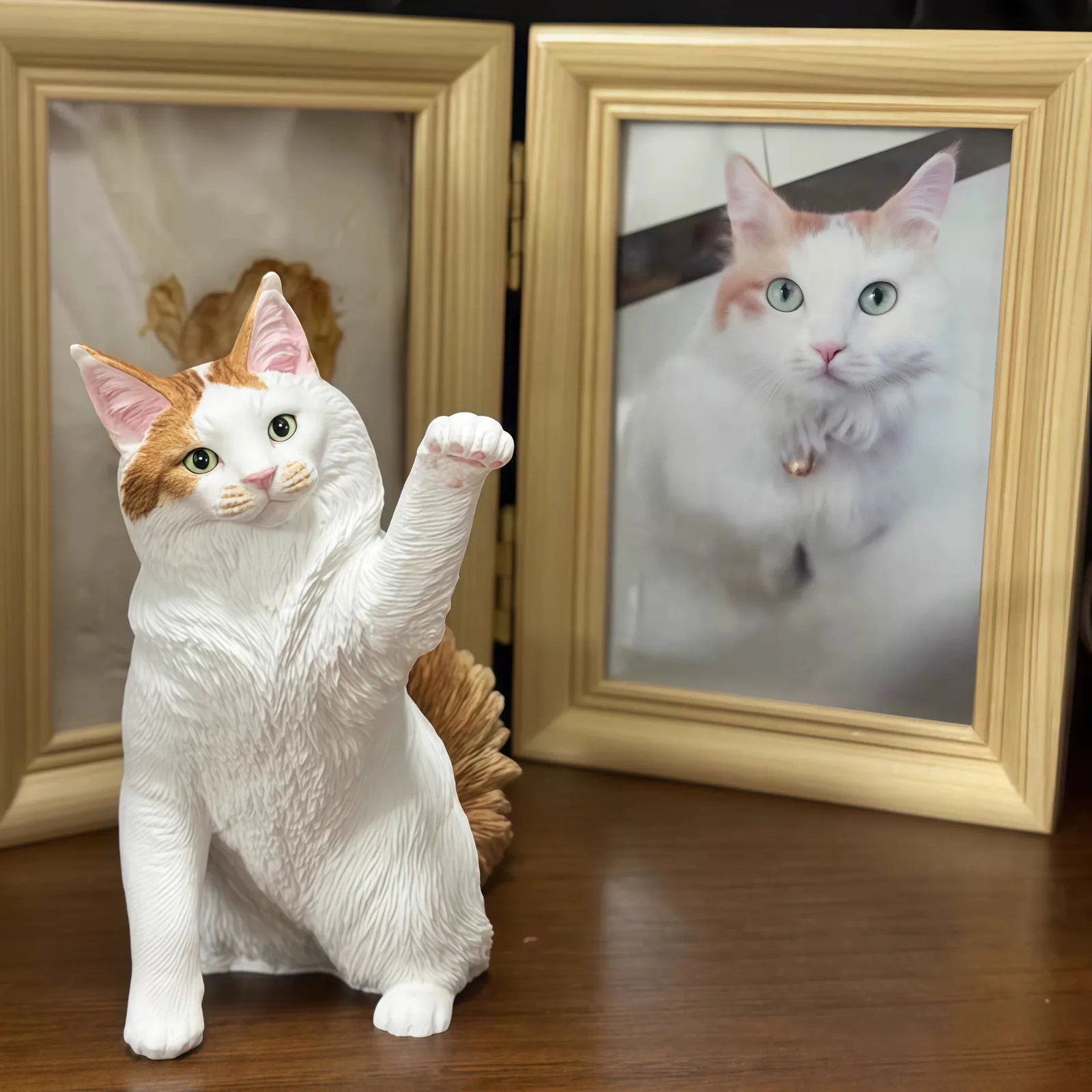 Mochi's tiny portrait displayed on a shelf